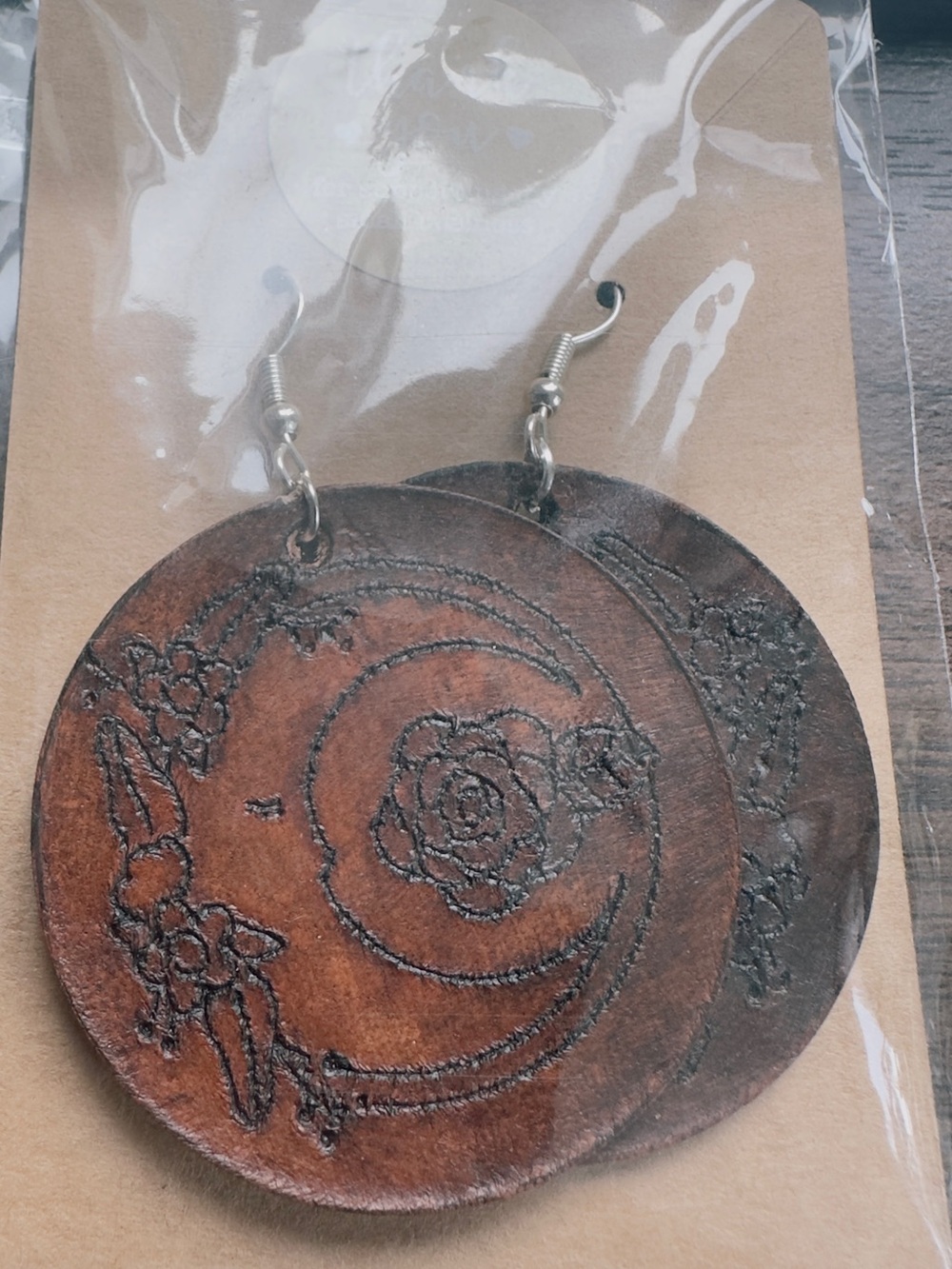 Handcrafted Brown Leather Drop Earrings with crescent moon and flowers.